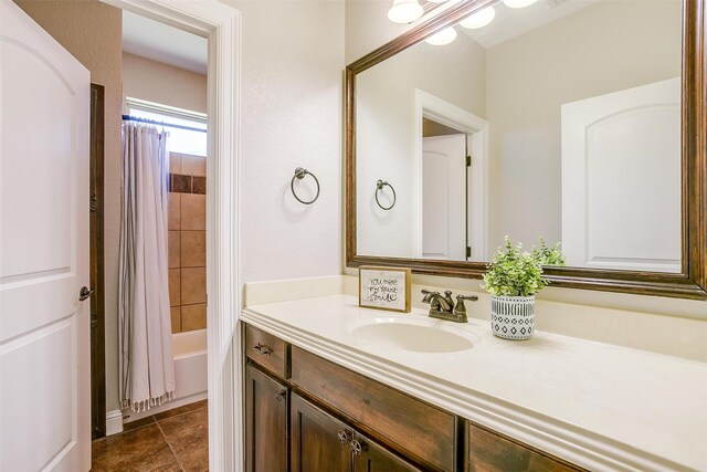 bathroom featuring shower / bath combo, vanity, and tile patterned floors