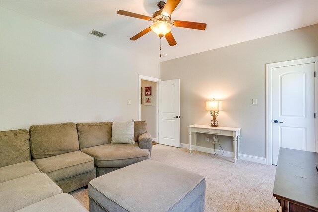 carpeted living room with ceiling fan