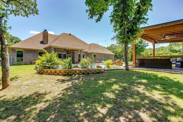 view of yard with a patio and ceiling fan