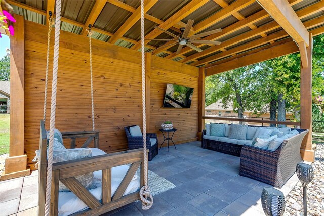 view of patio featuring an outdoor hangout area and ceiling fan