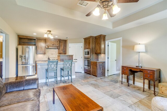 living room with ceiling fan