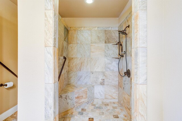 bathroom featuring tiled shower