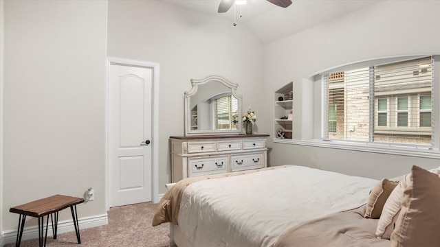 carpeted bedroom with ceiling fan and lofted ceiling