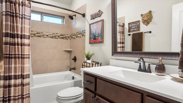 full bathroom featuring vanity, shower / bath combo, and toilet