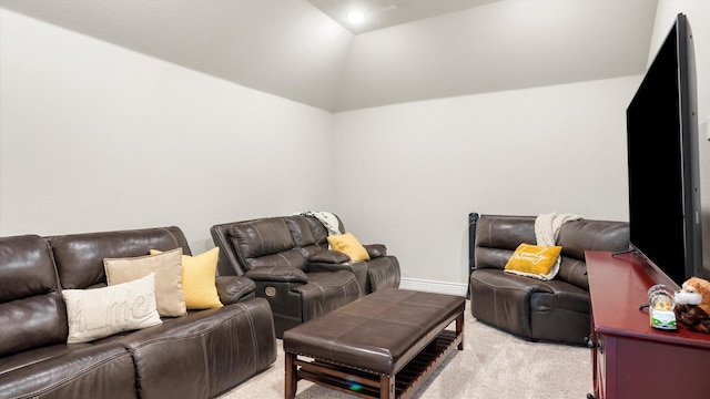 cinema with light carpet and lofted ceiling