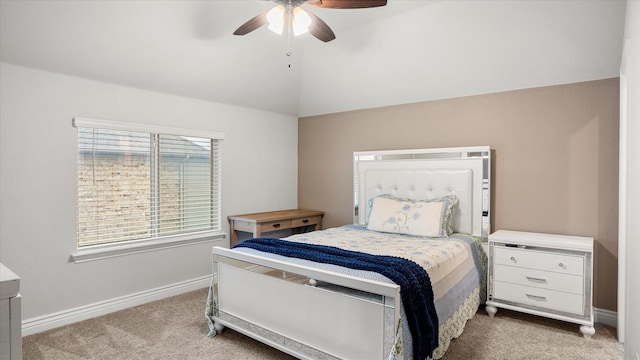 carpeted bedroom with vaulted ceiling and ceiling fan