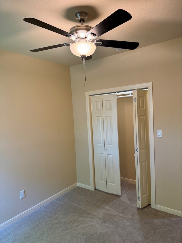 unfurnished bedroom featuring a closet, carpet, and ceiling fan