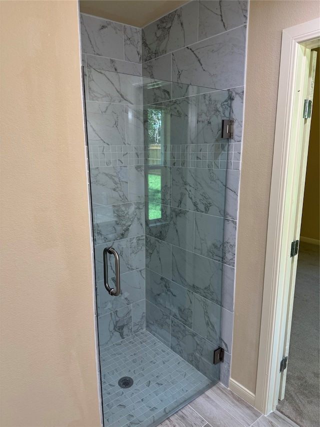 bathroom with an enclosed shower