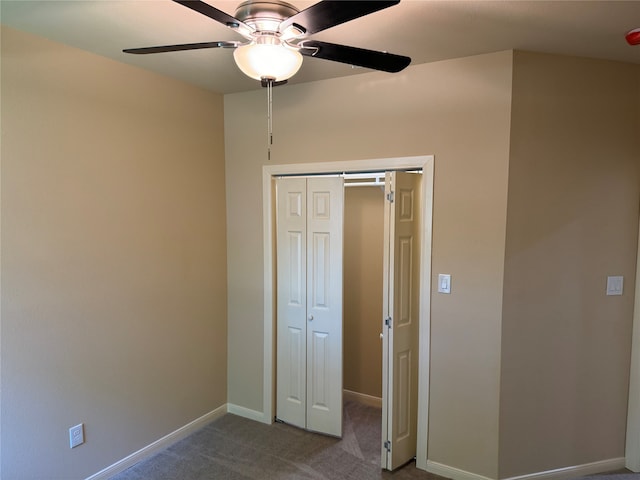 unfurnished bedroom featuring a closet, carpet, and ceiling fan