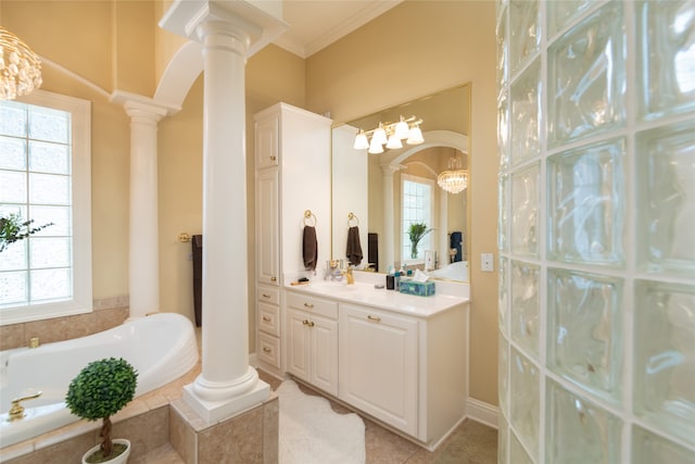 bathroom with vanity, tile patterned flooring, crown molding, decorative columns, and a relaxing tiled tub