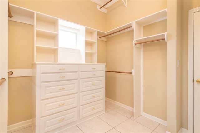 spacious closet featuring light tile patterned floors