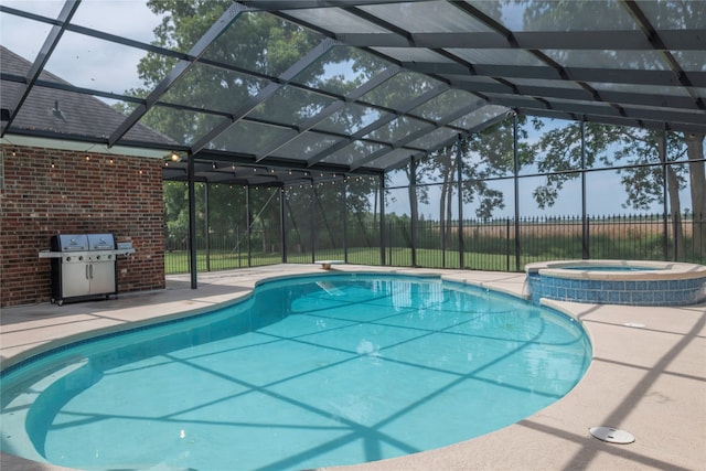 view of pool featuring an in ground hot tub, a grill, and a lanai