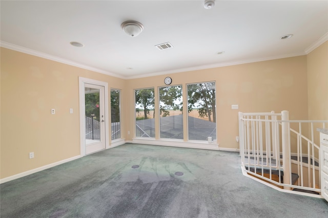 spare room with carpet and crown molding