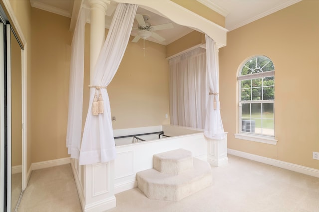 bathroom featuring ceiling fan and ornamental molding