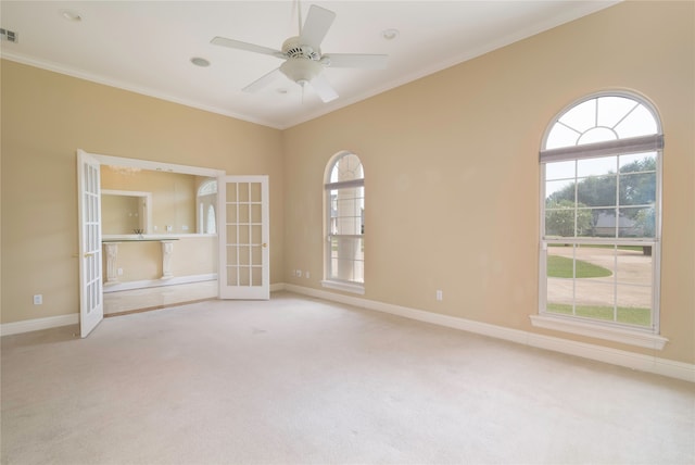 interior space featuring ceiling fan, crown molding, light colored carpet, and french doors