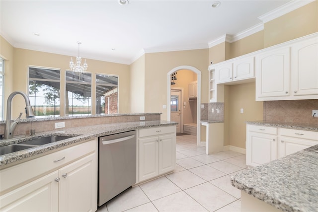 kitchen featuring light tile patterned flooring, backsplash, sink, dishwasher, and hanging light fixtures