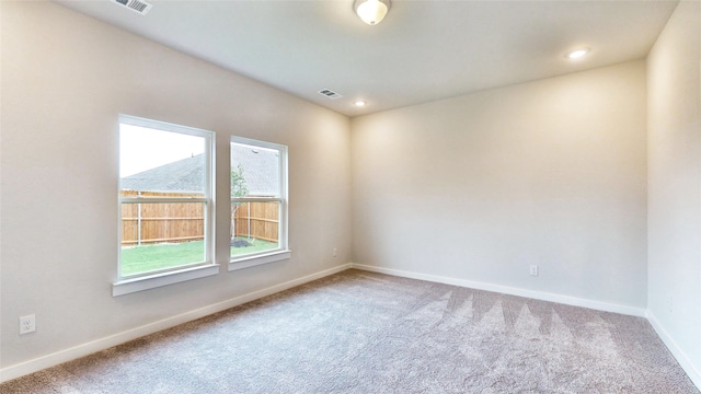 empty room with carpet flooring