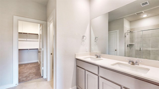 full bathroom with a stall shower, visible vents, and a sink