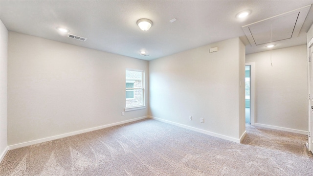 spare room with light colored carpet