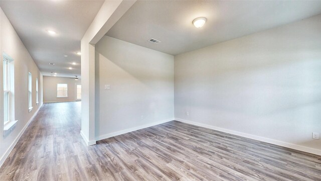 unfurnished room featuring hardwood / wood-style floors