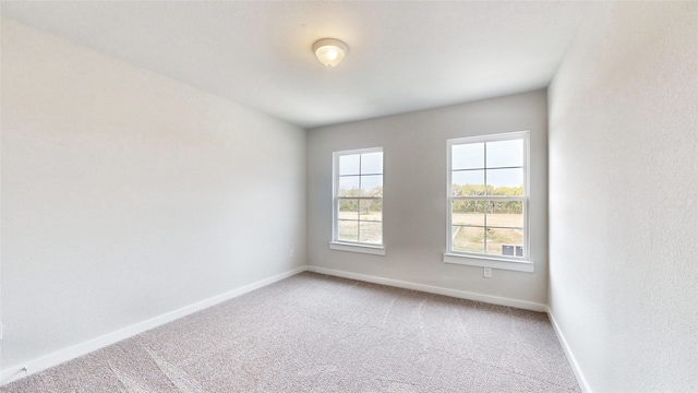 empty room with carpet flooring