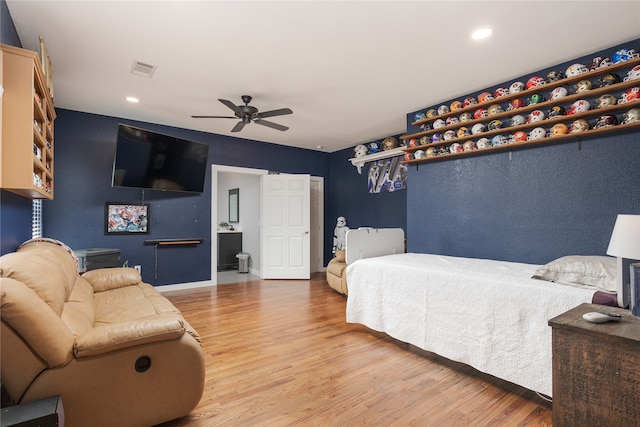 bedroom with hardwood / wood-style flooring and ceiling fan