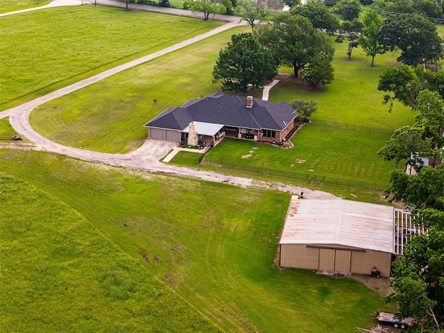 birds eye view of property with a rural view