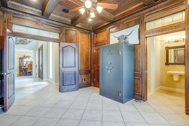 interior space featuring coffered ceiling, ceiling fan, wooden ceiling, ornamental molding, and beamed ceiling