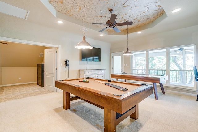 game room with pool table, light colored carpet, and a raised ceiling