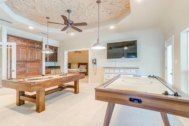 playroom featuring ceiling fan, a tray ceiling, light carpet, a textured ceiling, and billiards