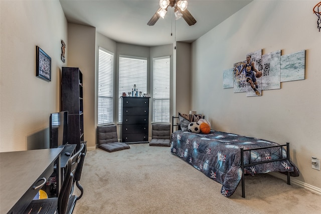 bedroom with light carpet and ceiling fan