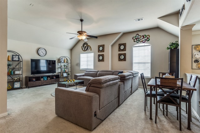 carpeted living room with plenty of natural light, lofted ceiling, and ceiling fan