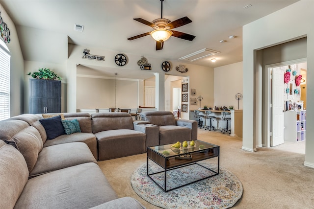 carpeted living room with ceiling fan