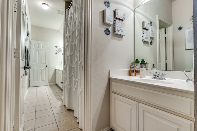 bathroom with vanity and tile patterned floors