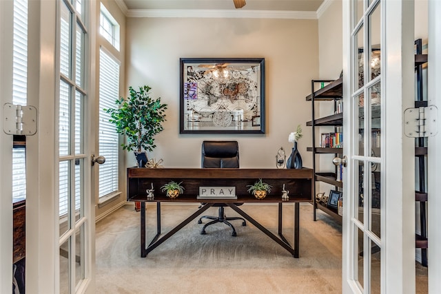 carpeted office space with crown molding, a wealth of natural light, and french doors