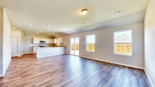 unfurnished living room featuring light hardwood / wood-style flooring