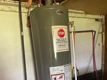 utility room with water heater