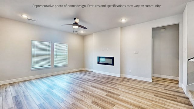 unfurnished living room featuring ceiling fan and light hardwood / wood-style flooring