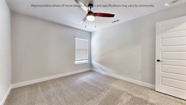 spare room with carpet and ceiling fan