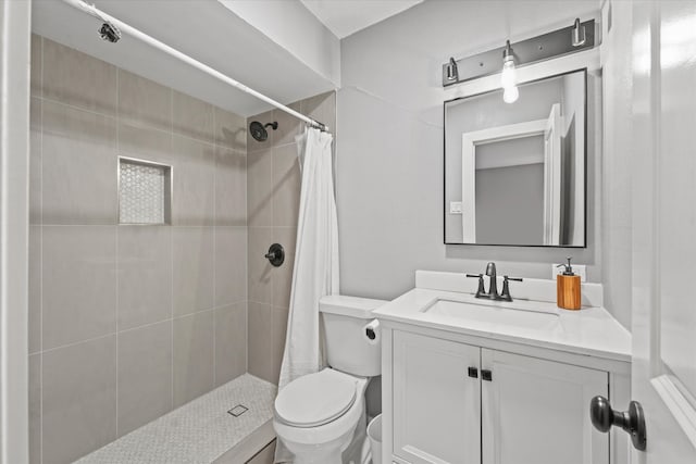 bathroom with walk in shower, oversized vanity, and toilet