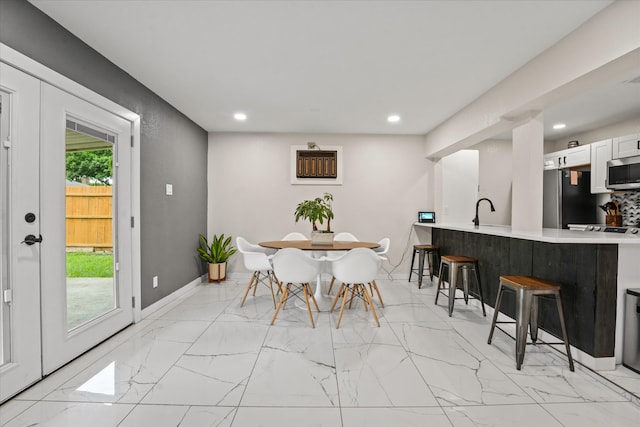 tiled dining space with sink