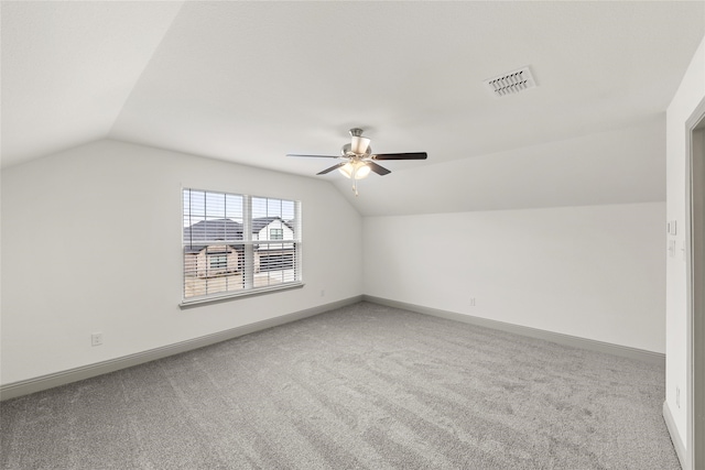 bonus room featuring ceiling fan, carpet floors, and vaulted ceiling