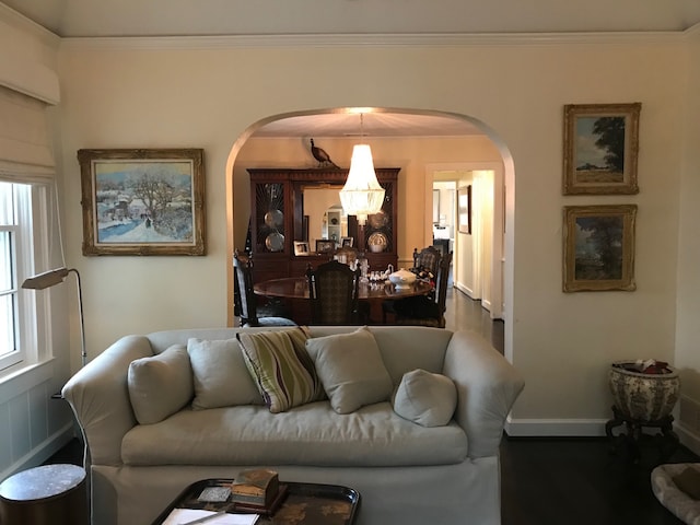 living room with ornamental molding