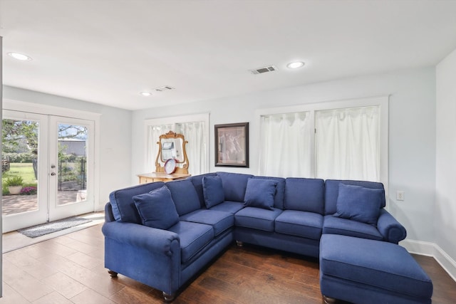 living room featuring french doors and dark hardwood / wood-style flooring