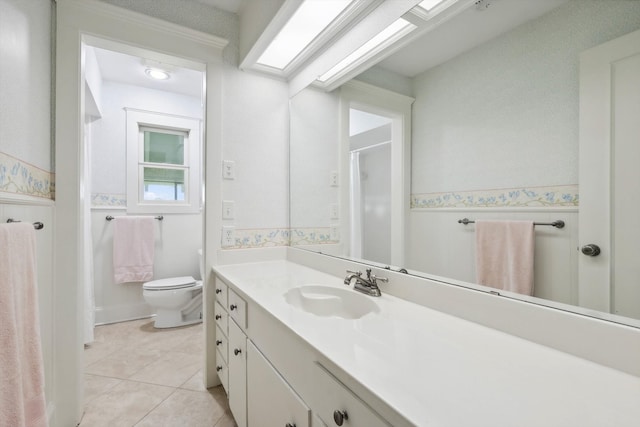 bathroom with vanity, a shower, toilet, and tile patterned flooring