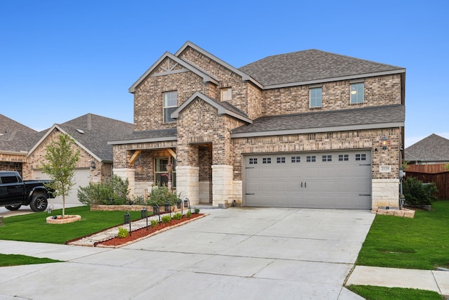 craftsman-style home with a garage and a front lawn