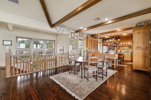 dining area featuring dark wood-type flooring and beam ceiling