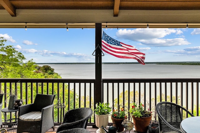 balcony featuring a water view