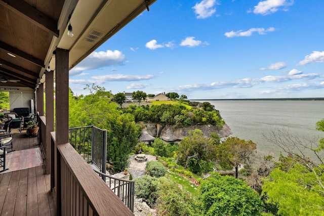 balcony with a deck with water view