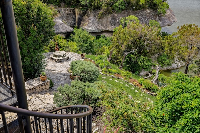 view of yard featuring a patio and a water view